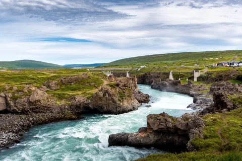 View of the flowing river from Goðafoss waterfall near Akureyri