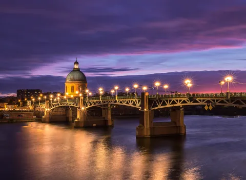 Saint-Pierre Bridge and Saint-Joseph Chapel in Toulouse at sunset