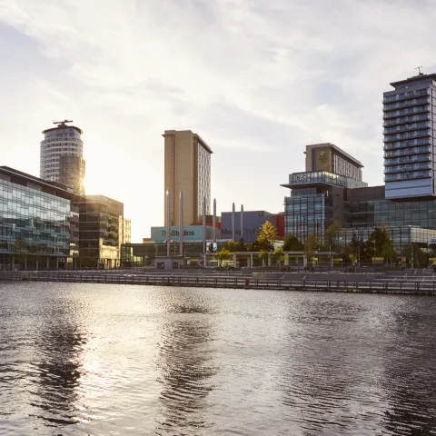 View of Manchester from the river, with high buildings in the background