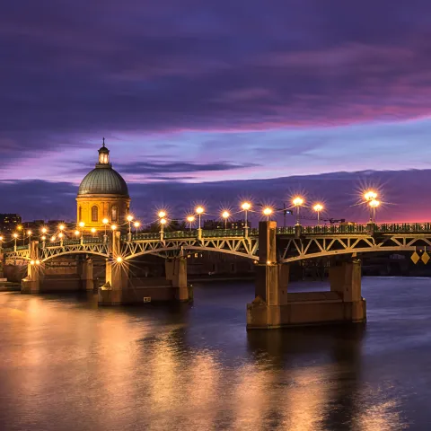 Saint-Pierre Bridge and Saint-Joseph Chapel in Toulouse at sunset